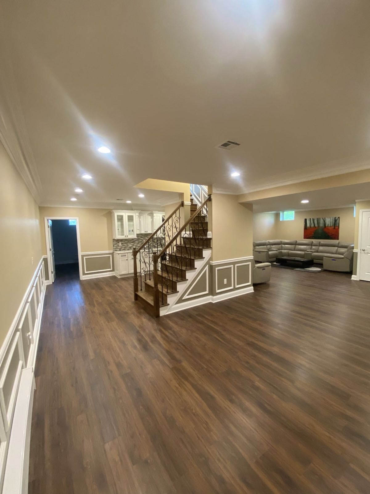 Finished basement with staircase and kitchenette