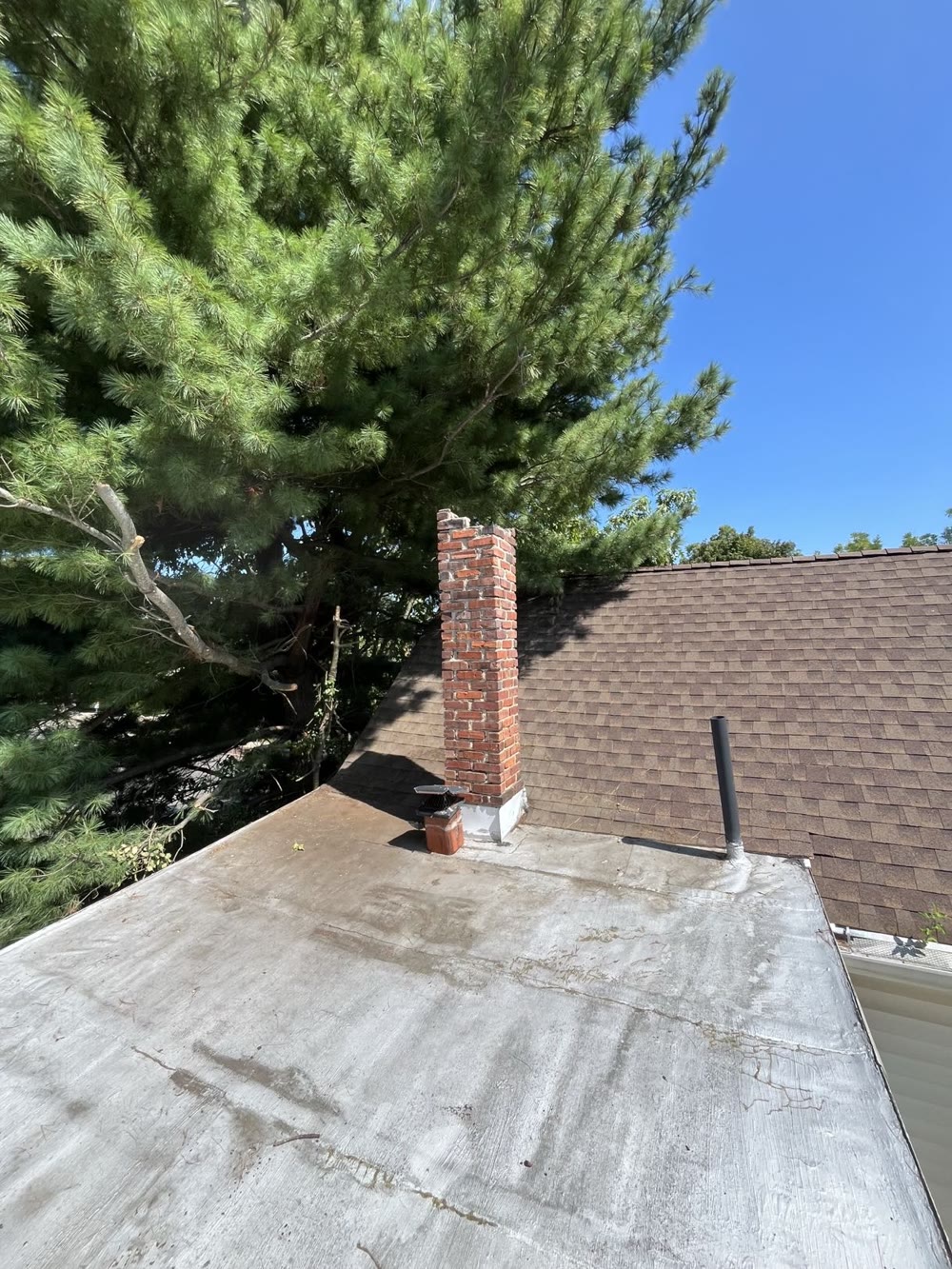 Crumbling brick chimney before repair
