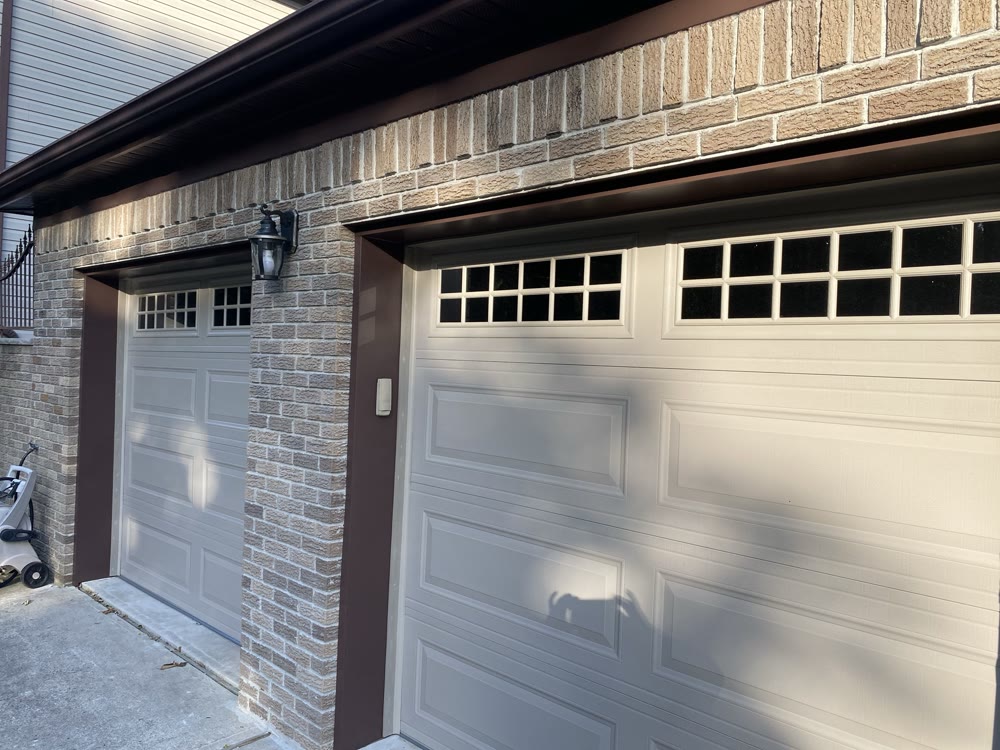 Garage with stone veneer and new doors