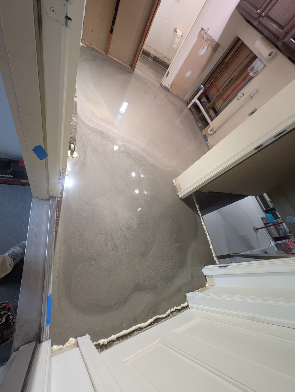 Laundry room floor after primer and self-leveling