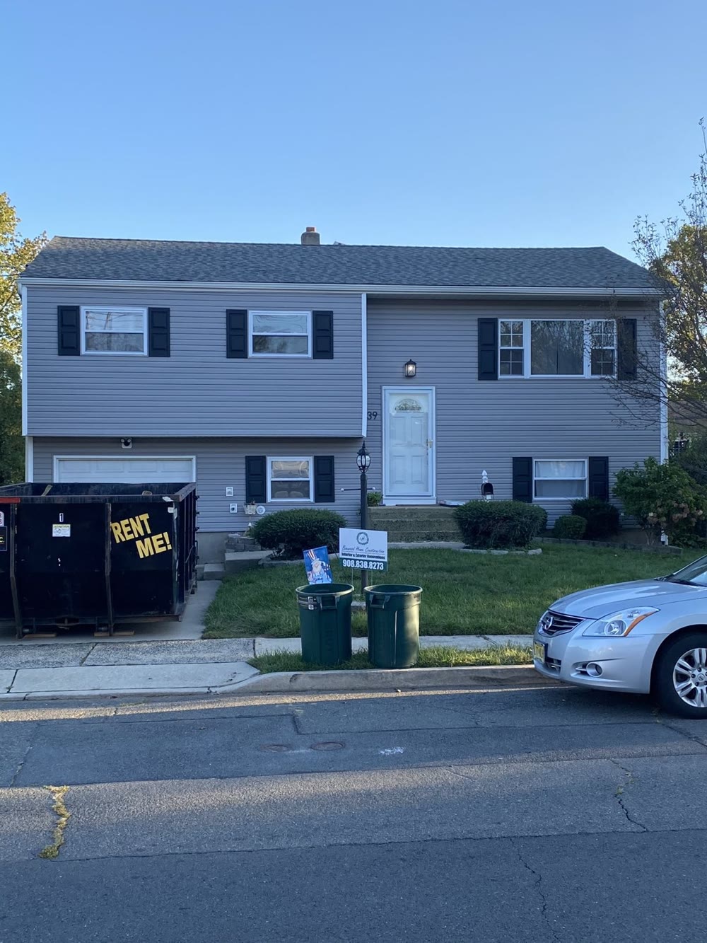 New siding and roof with Boxwood yard sign