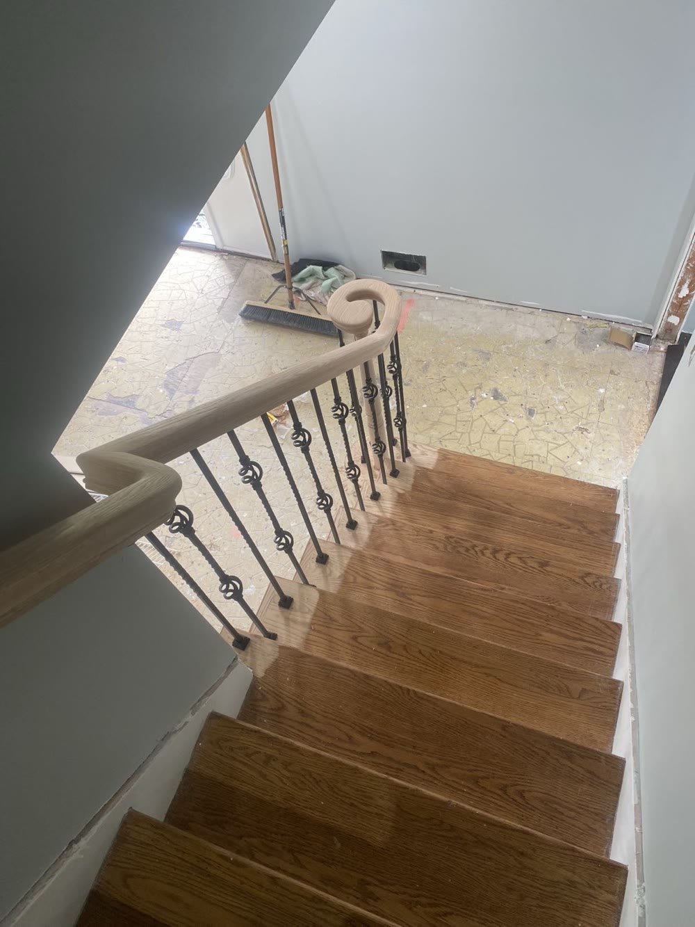 Custom staircase with iron balusters