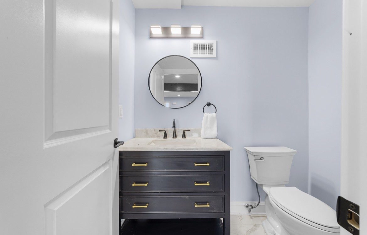 Entry with beam and iron staircase