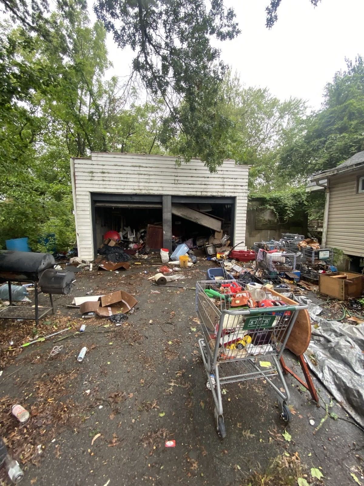 Back of house with rotting deck