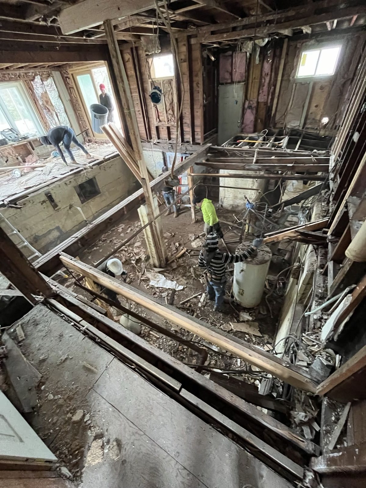 Crew removing damaged joists