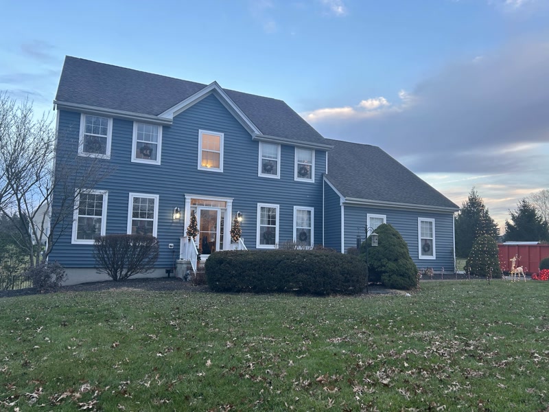 House after siding renovation with new blue siding